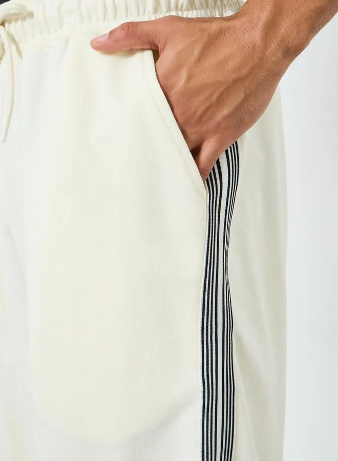 Styli Men Off-White Striped Terry Oversized Shorts